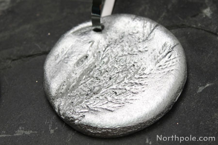 I used fresh evergreens to make an impression on this ornament.