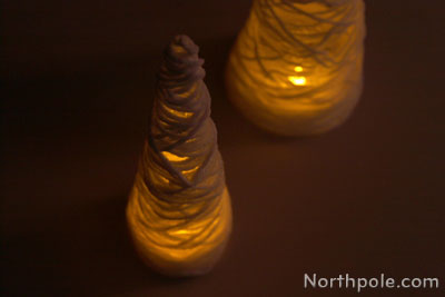 Make a yarn tree and place flameless candle inside