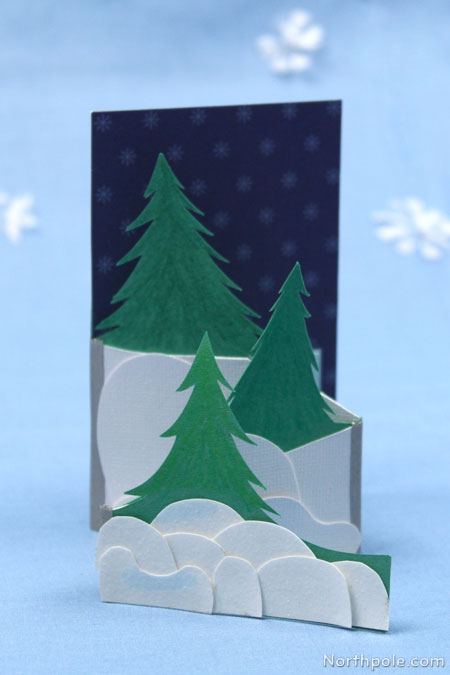 Use an X-Acto to add branches to the trees on your card.