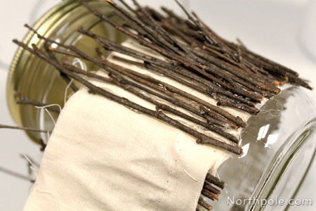 Glue twigs to fabric